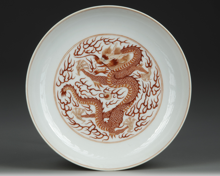 A CHINESE IRON-RED DRAGON DISH, 19TH/20TH CENTURY