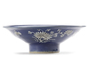A CHINESE BLUE-GROUND SLIP DECORATED BOWL, 17TH CENTURY