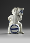 A BLUE AND WHITE BACCHUS ON A WINE BARREL, PROBABLY BRUSSELS 18TH CENTURY