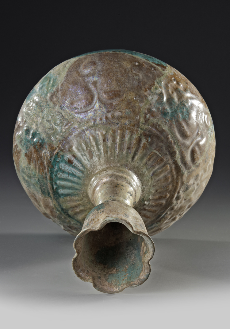A Kashan Turquoise Glazed Moulded Bottle Vase Persia 12th Century