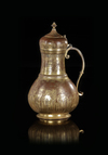 AN OTTOMAN GILT-COPPER (TOMBAK) BOZALIK (BOZA EWER), TURKEY, DATED 1194 AH/1780 AD