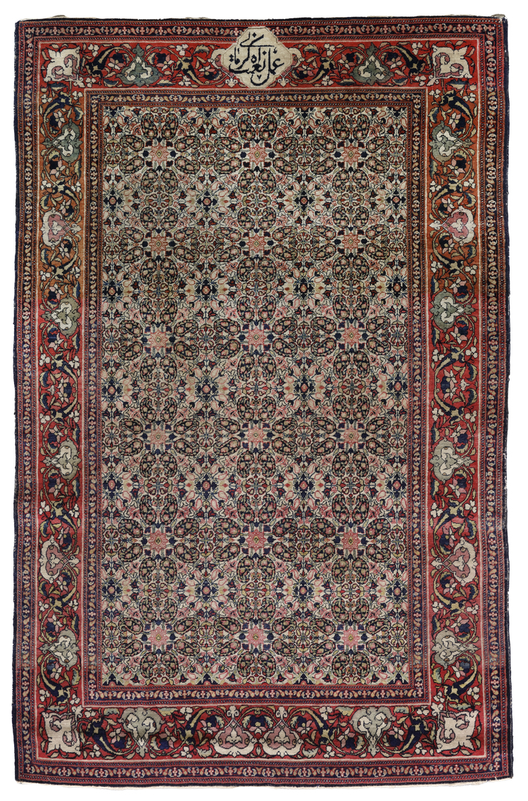 A SIGNED KERMAN RUG, PERSIA, LATE 19TH CENTURY