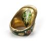 A GEM-SET AND ENAMELLED GOLD ARCHER'S RING, NORTH INDIA, CIRCA 18TH CENTURY