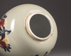 A Chinese celadon-ground 'nine peaches' ovoid jar