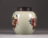 A Chinese celadon-ground 'nine peaches' ovoid jar