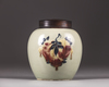 A Chinese celadon-ground 'nine peaches' ovoid jar