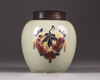 A Chinese celadon-ground 'nine peaches' ovoid jar
