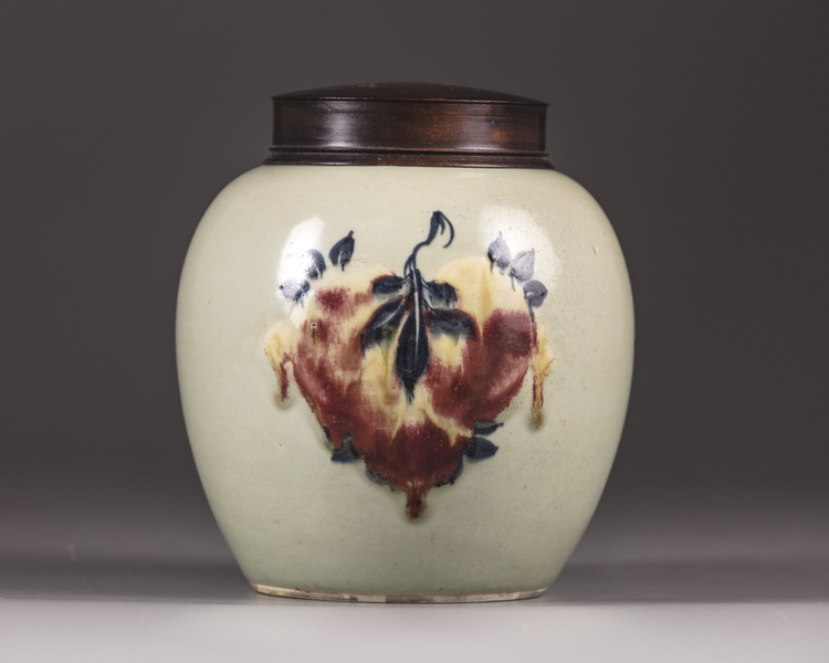A Chinese celadon-ground 'nine peaches' ovoid jar