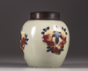 A Chinese celadon-ground 'nine peaches' ovoid jar