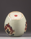 A Chinese celadon-ground 'nine peaches' ovoid jar