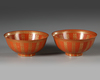 A PAIR OF CHINESE RED GLAZED BOWLS WITH CHARACTERS, 19TH CENTURY
