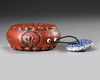 A JAPANESE RED LACQUERED ROUND INRO, 19TH CENTURY