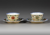 A PAIR OF CAFE AU-LAIT GROUND FAMILLE VERTE CUPS AND SAUCERS, KANGXI PERIOD (1662-1722)