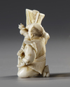 A JAPANESE OKIMONO OF A DREAMING MAN HOLDING A SCROLL, 19TH CENTURY