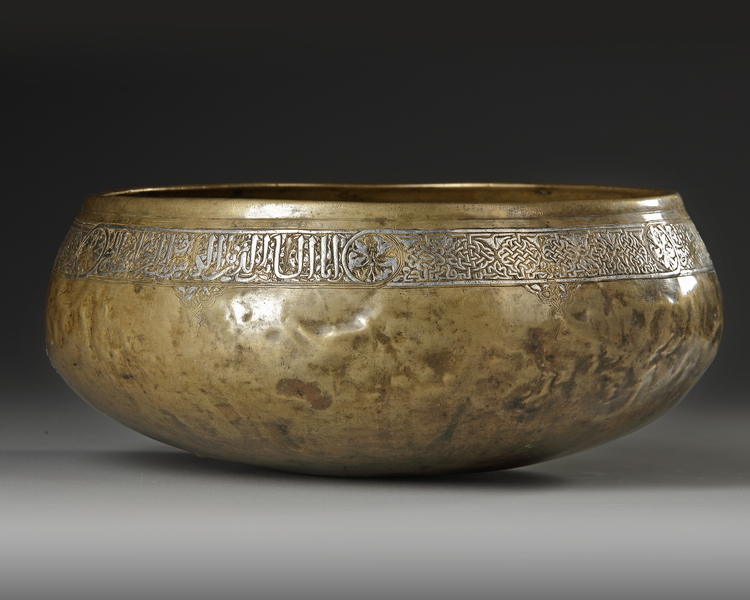 A MAMLUK SILVER INLAID BRASS BOWL, EGYPT OR SYRIA,  EARLY 14TH CENTURY