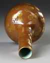 A CHINESE BROWN-GROUND GILT-DECORATED BOTTLE VASE, QING DYNASTY (1644-1911)