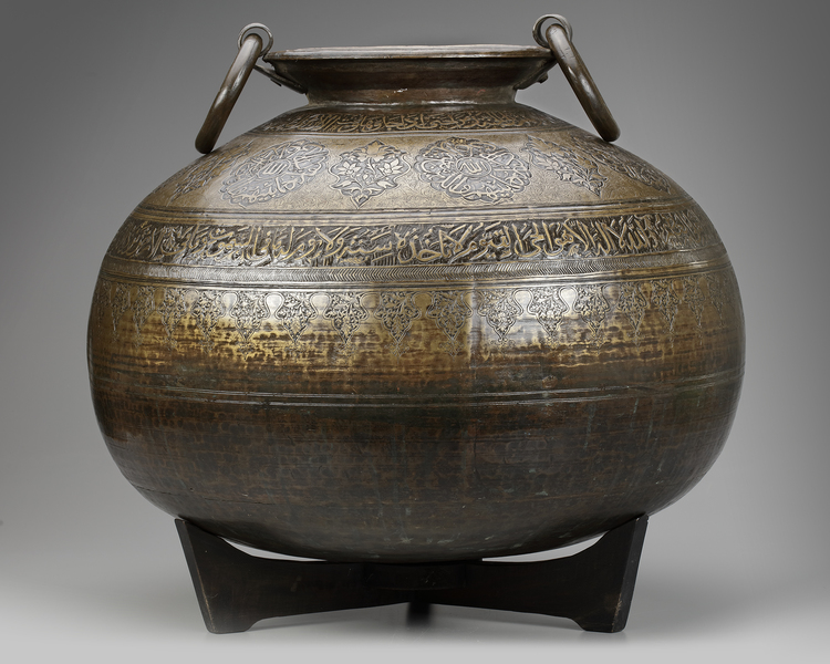 A LARGE CARVED BRASS VESSEL, MOROCCO, 16TH CENTURY