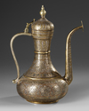 A FINE MAMLUK REVIVAL SILVER AND COPPER INLAID BRASS EWER, 19TH CENTURY