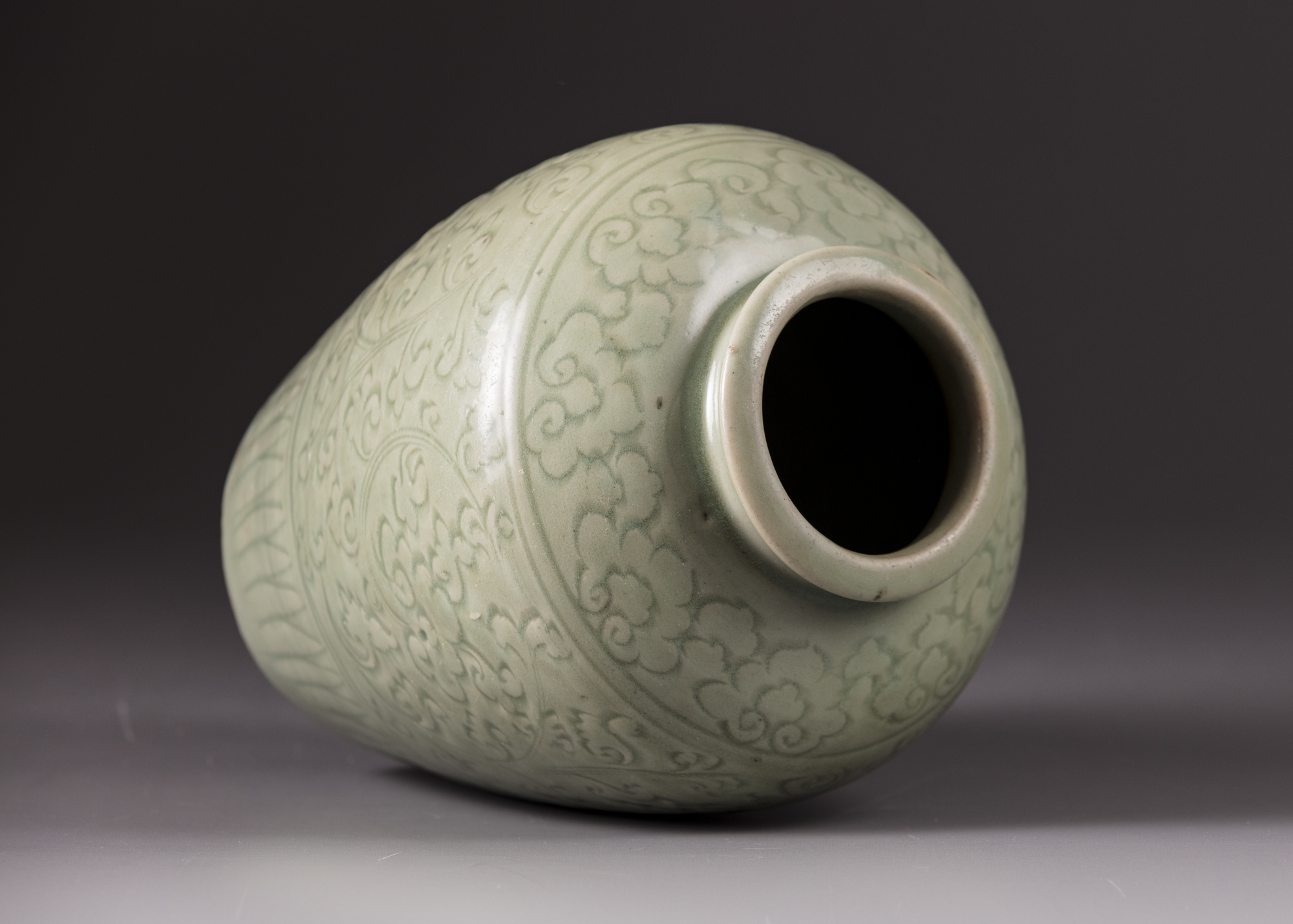 A celadon-glazed pot