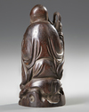 A CHINESE WOOD CARVING OF A LOHAN,20TH CENTURY