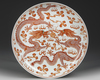 A CHINESE IRON-RED-DECORATED DRAGON DISH,  19TH/20TH CENTURY