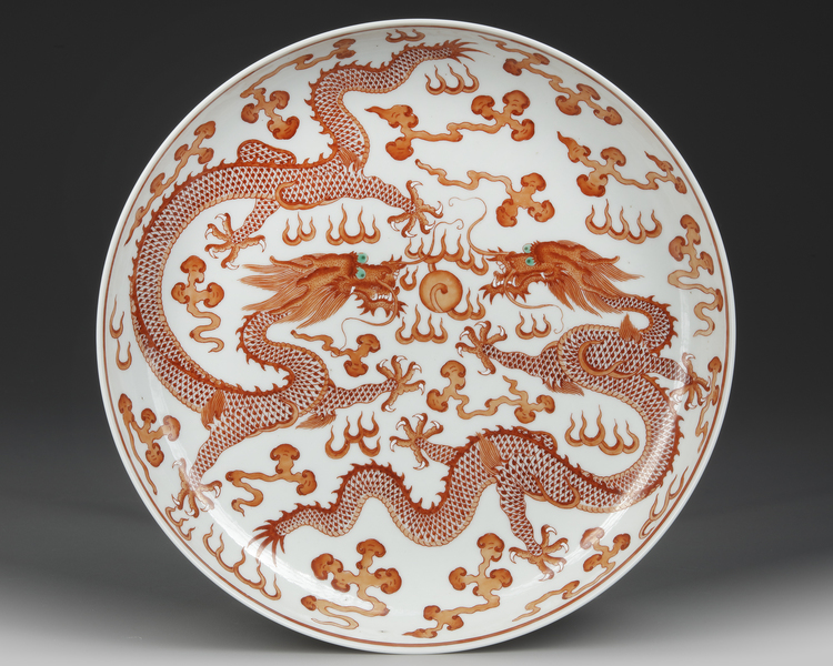 A CHINESE IRON-RED-DECORATED DRAGON DISH,  19TH-20TH CENTURY