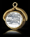 AN ACHAEMENID BLUE CHALCEDONY SEAL IN GOLD MOUNT, 5TH CENTURY BC