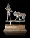 A BRONZE APPLIQUE OF A PAN AND A BULL, HELLENISTIC, 2ND-1ST CENTURY BC