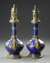 A PAIR PORCELAIN AND BRONZE HAND PAINTED OIL LAMPS, FRANCE, EMPIRE, EARLY 19TH CENTURY