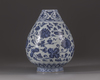 A small blue and white vase
