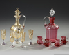 TWO BOHEMIAN LIQUOR SETS ATTRIBUTED TO MOSER, CIRCA 1880-1900