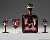 A BOHEMIAN CARAFE WITH THREE GLASSES, CIRCA 1900