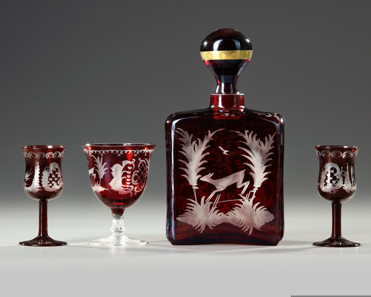 A BOHEMIAN CARAFE WITH THREE GLASSES, CIRCA 1900