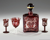 A BOHEMIAN CARAFE WITH THREE GLASSES, CIRCA 1900