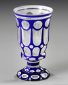 A BOHEMIAN OVERLAY GLASS GOBLET, CIRCA 1860