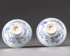 A pair of blue and white conical shaped bowls