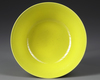 A CHINESE LEMON-YELLOW-ENAMELED BOWL, QING DYNASTY (1644–1911)