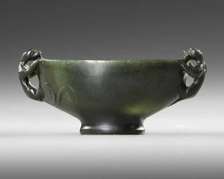 A CHINESE CARVED SPINACH-GREEN JADE BOWL, 18TH-19TH CENTURY