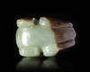 A CHINESE SPINACH CARVED JADE FU DOG, MING DYNASTY (1368-1644)