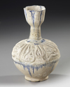 A KASHAN MOULDED BOTTLE VASE, PERSIA, 12TH CENTURY
