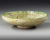 A NISHAPUR BUFFWARE POTTERY BOWL, PERSIA, 10TH CENTURY