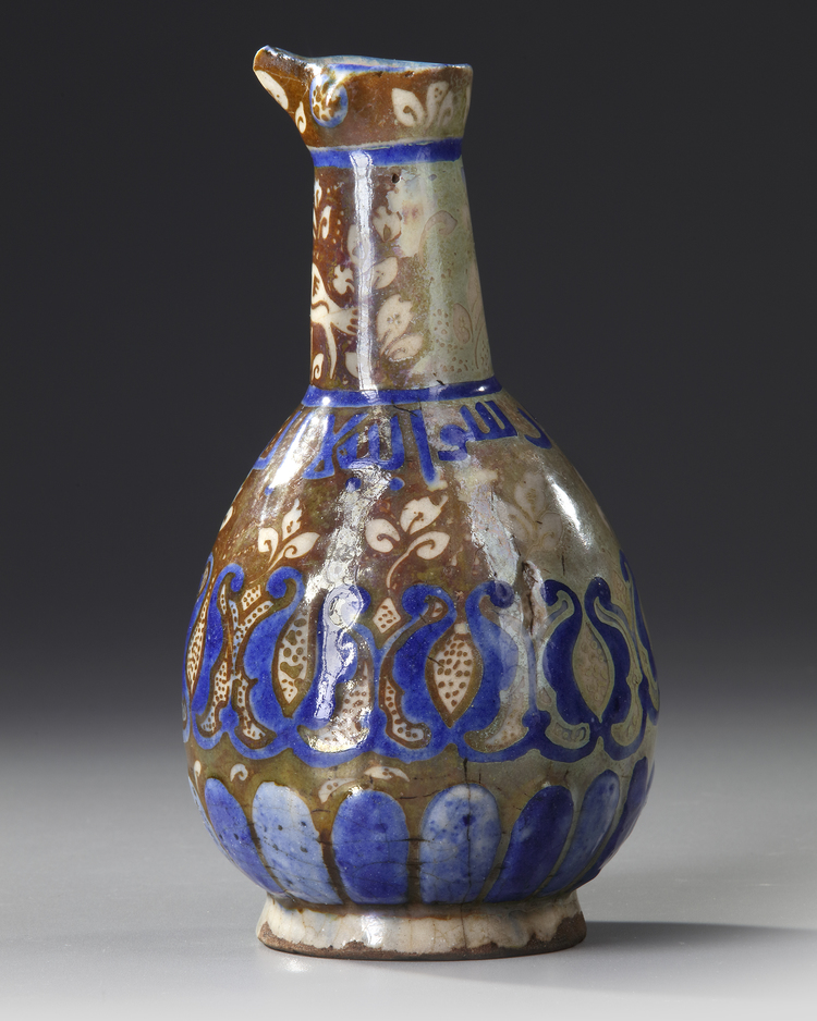 A SMALL KASHAN LUSTRE POTTERY JUG, PERSIA 13TH CENTURY