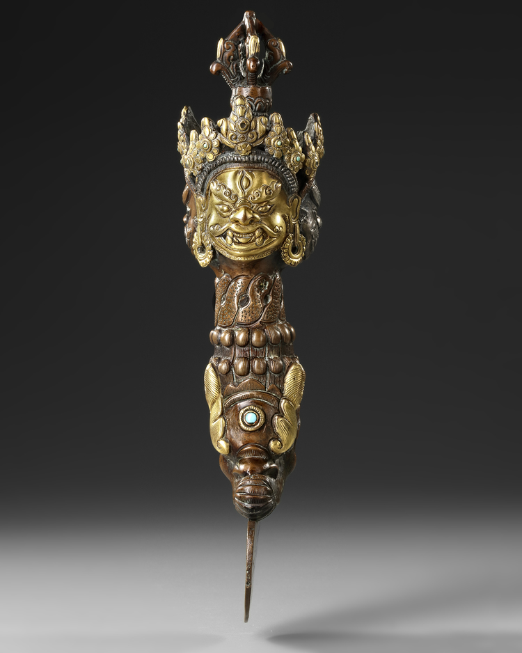 A BRONZE BUDDHIST PHURBA, POSSIBLY NEPALESE, EARLY 20TH CENTURY