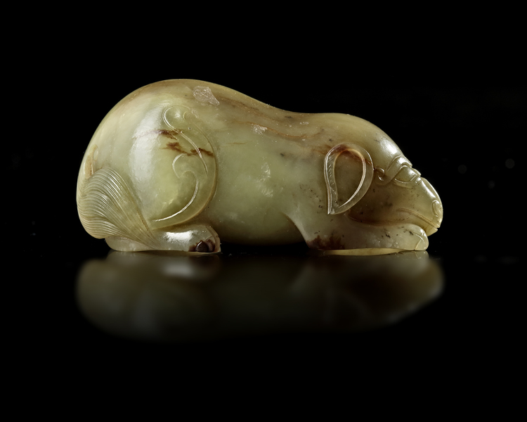 A CHINESE CARVED JADE MYTHICAL BEAST, QING DYNASTY (1644–1911)