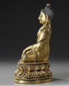 A CHINESE GILT- BRONZE FIGURE OF SHAKYAMUNI BUDDHA,  QING DYNASTY (1644–1911)