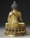 A CHINESE GILT- BRONZE FIGURE OF SHAKYAMUNI BUDDHA,  QING DYNASTY (1644–1911)