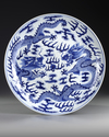A CHINESE BLUE AND WHITE DRAGON DISH, 19TH-20TH CENTURY
