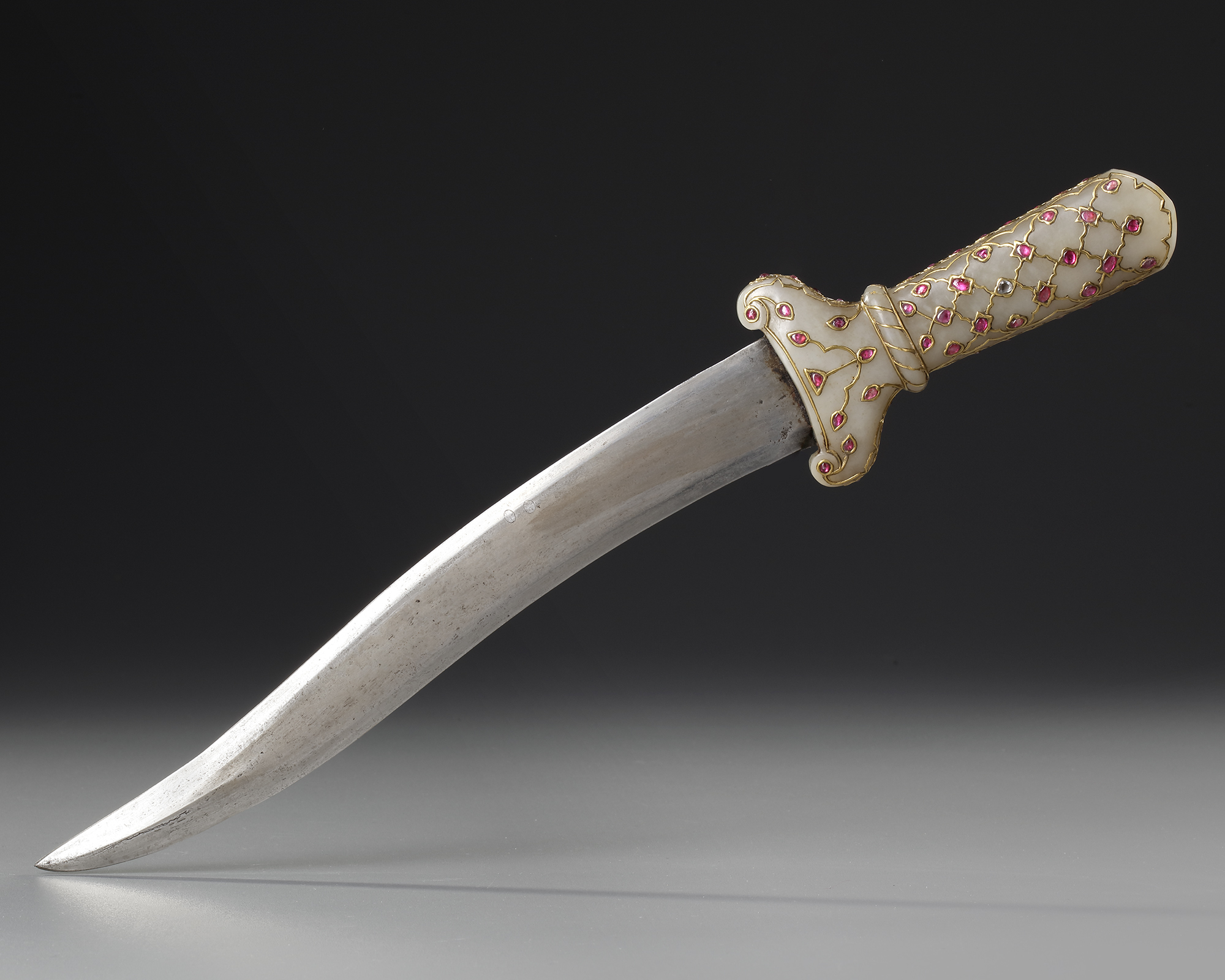 A FINE MUGHAL GEM-SET JADE-HILTED DAGGER, JAHANGIR PERIOD, 17TH