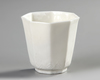 A CHINESE DEHUA OCTAGONAL CUP, 17TH CENTURY