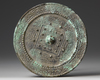 A CHINESE CIRCULAR 'TLV' BRONZE MIRROR,  XIN-EARLY EASTERN HAN DYNASTY, 1ST CENTURY